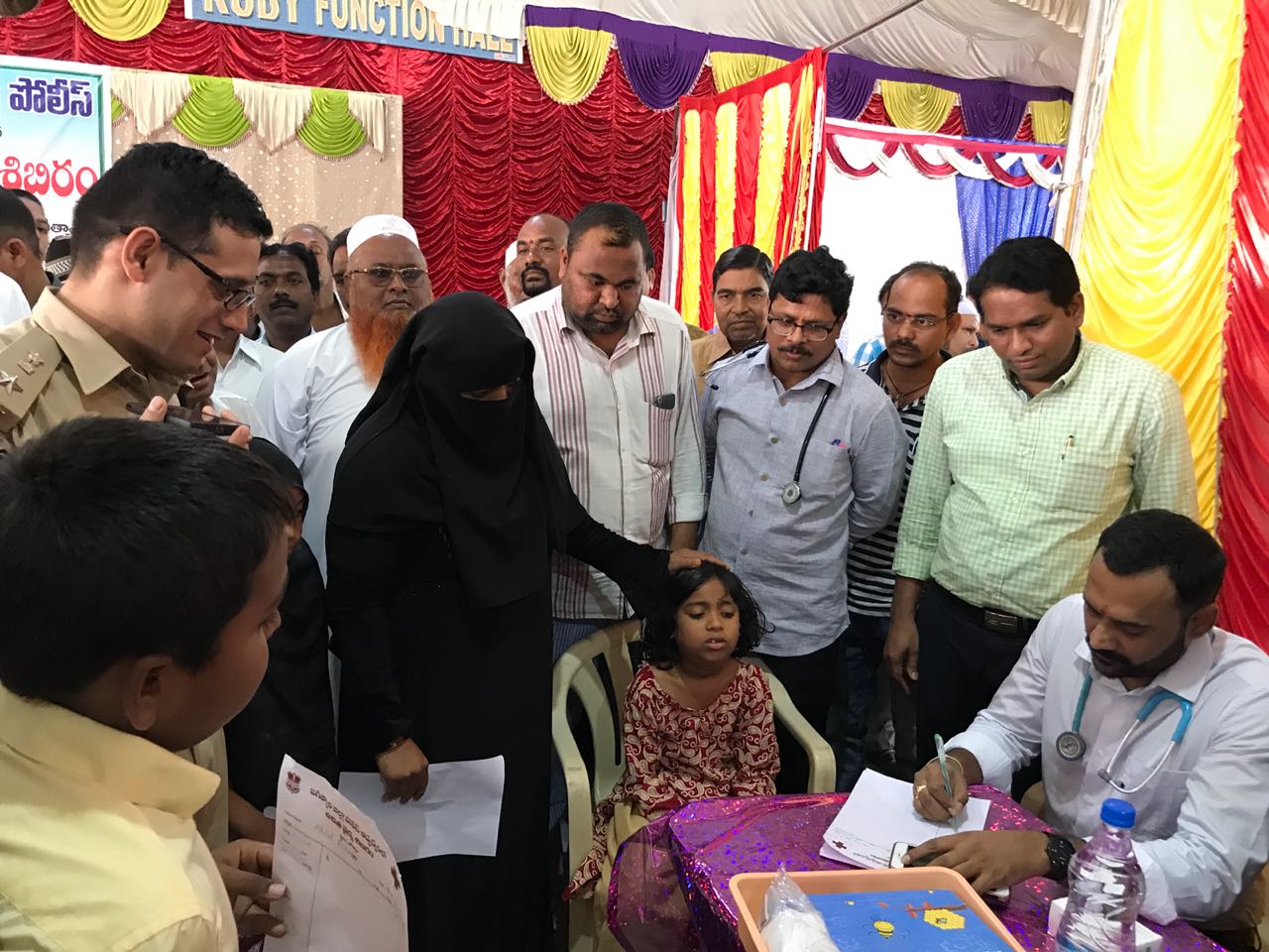 Doctor treating young girl at Free Camp